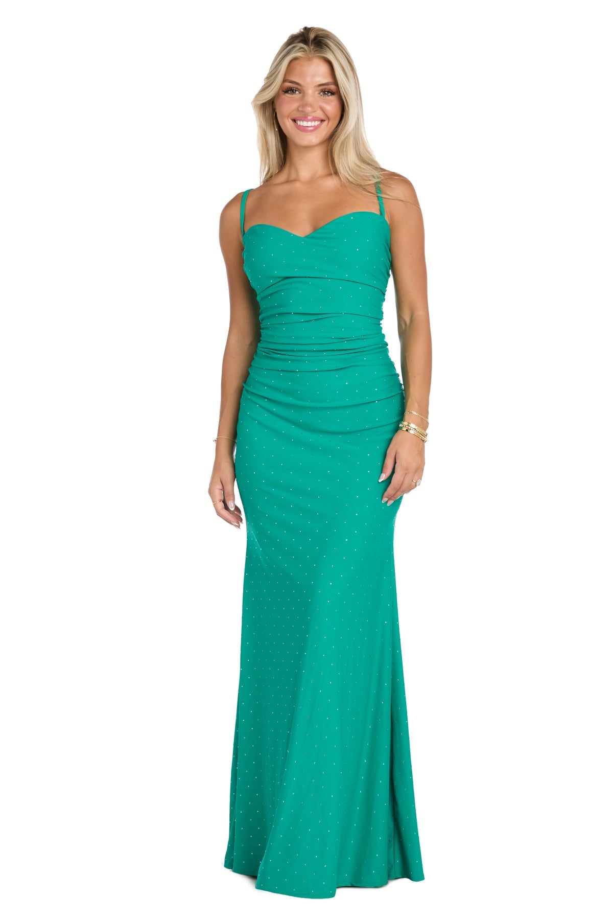 A woman stands and smiles against a white background in the Jade Green Long Ruched Prom Dress: Morgan 19016, a fitted, sleeveless gown with subtle sparkling details.